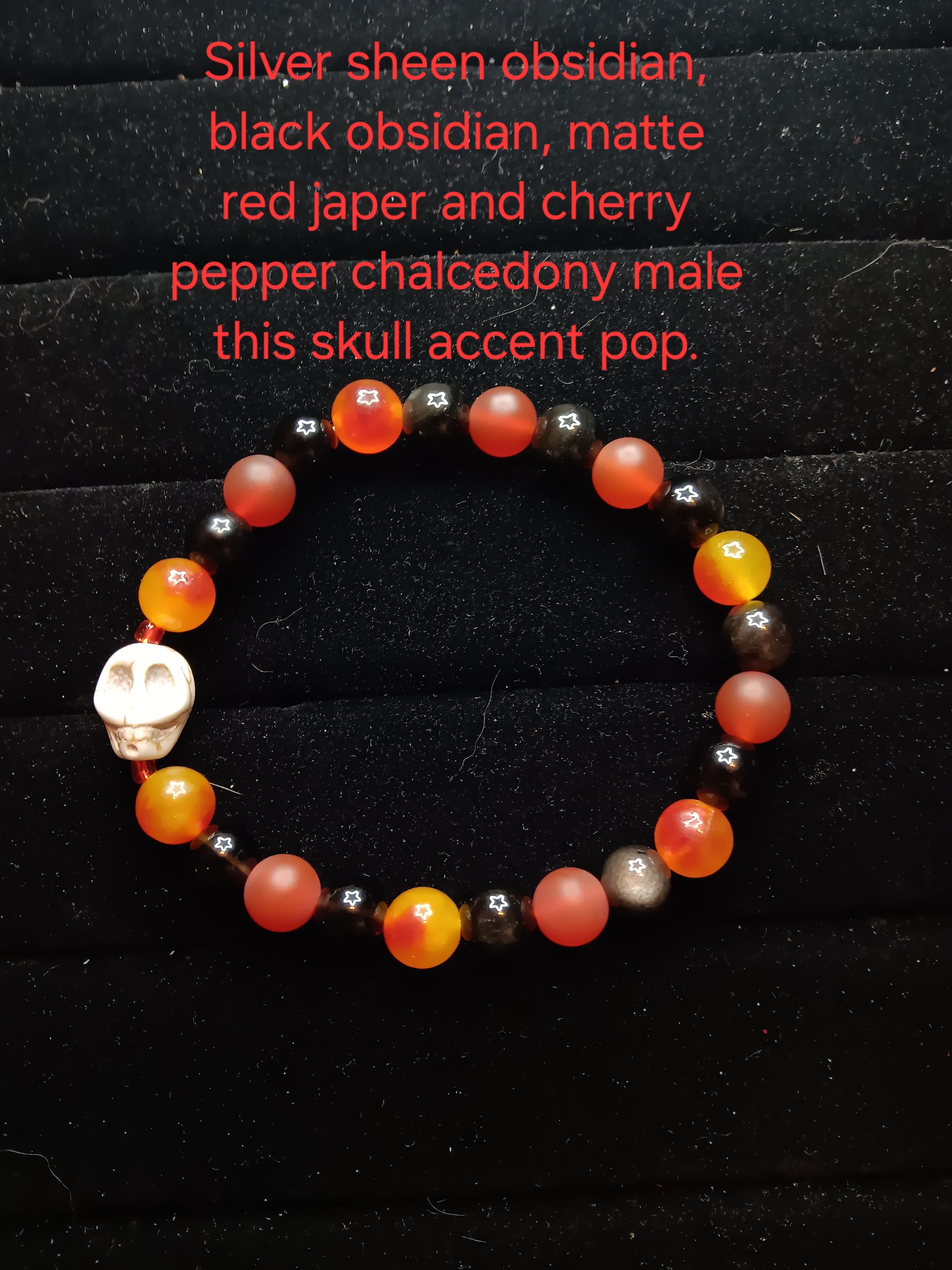 Black obsidian, silver sheen obsidian, matte red jasper and cherry pepper chalcedony skull bracelet