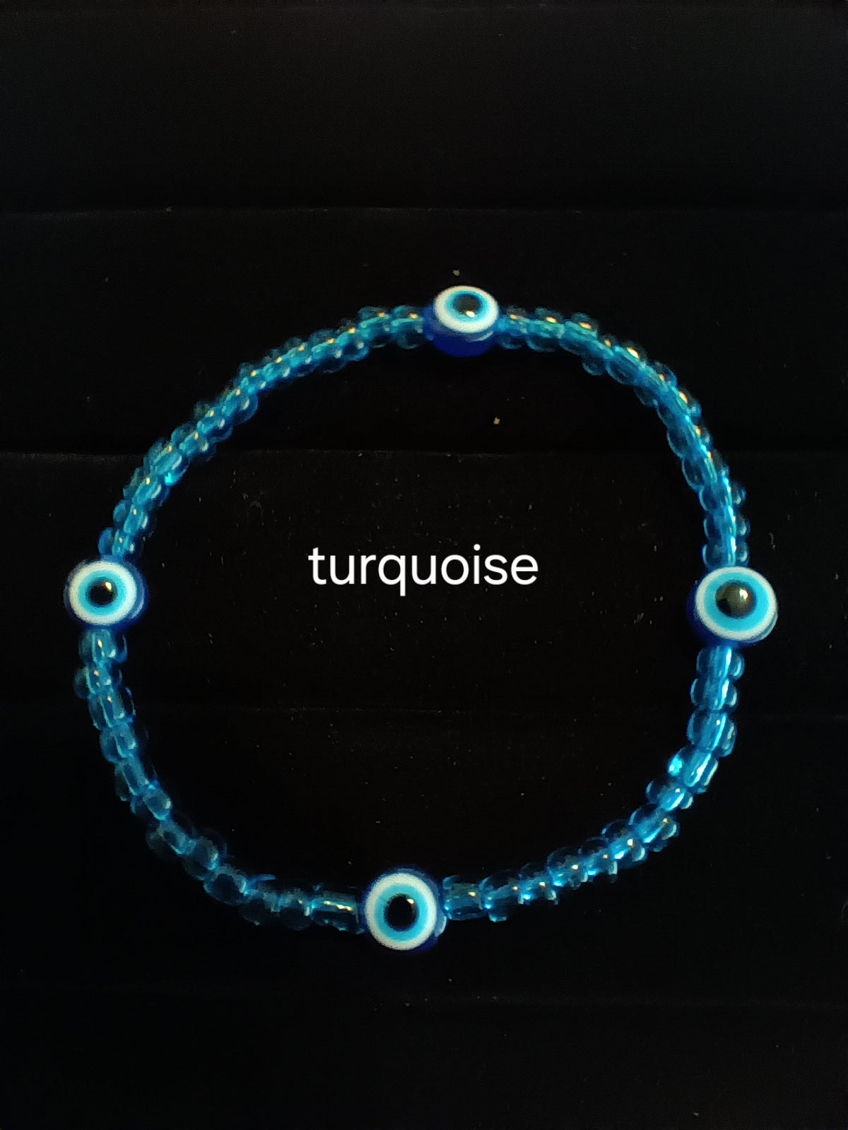 Single strand evil eye stretch bracelet